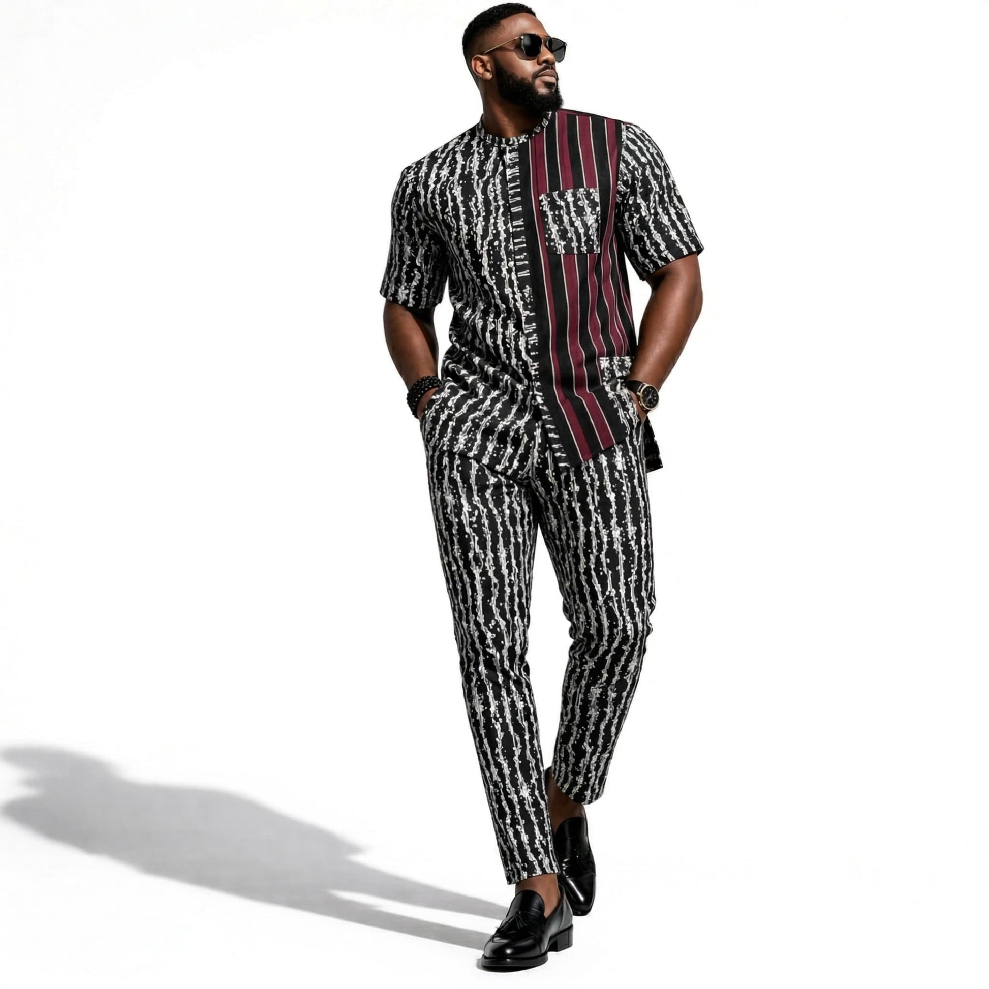 Man wearing a patterned outfit on a white background