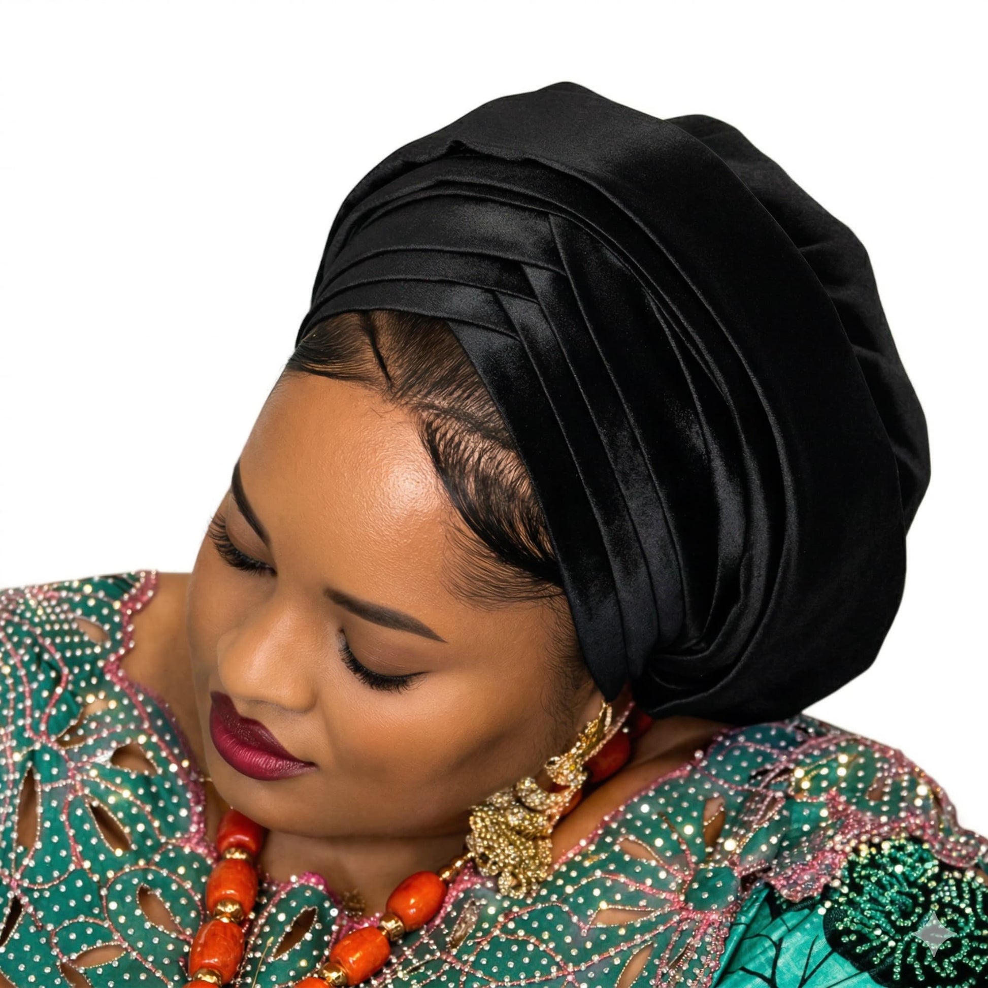 Woman wearing a black headscarf and colorful traditional outfit on a white background