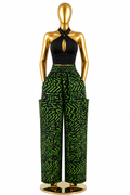 Men's Ankara wide-leg cargo pants in purple sunburst circle print on white with bold black circles and patch pockets