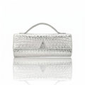 Silver clutch bag with a textured pattern on a white background