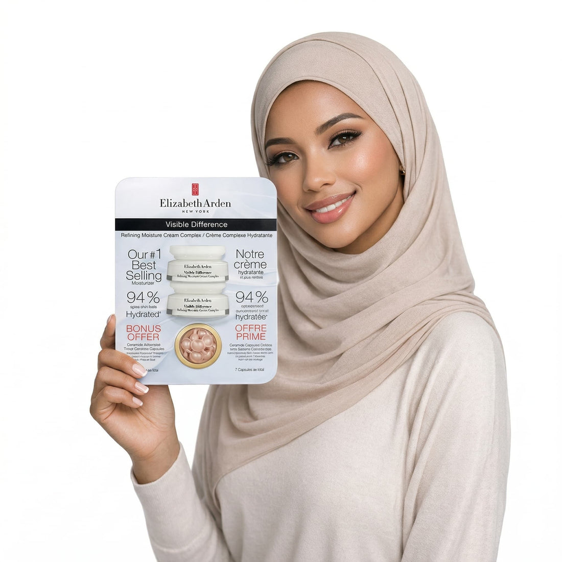 Woman holding a skincare product packaging with a neutral background
