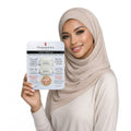 Woman holding a skincare product packaging with a neutral background