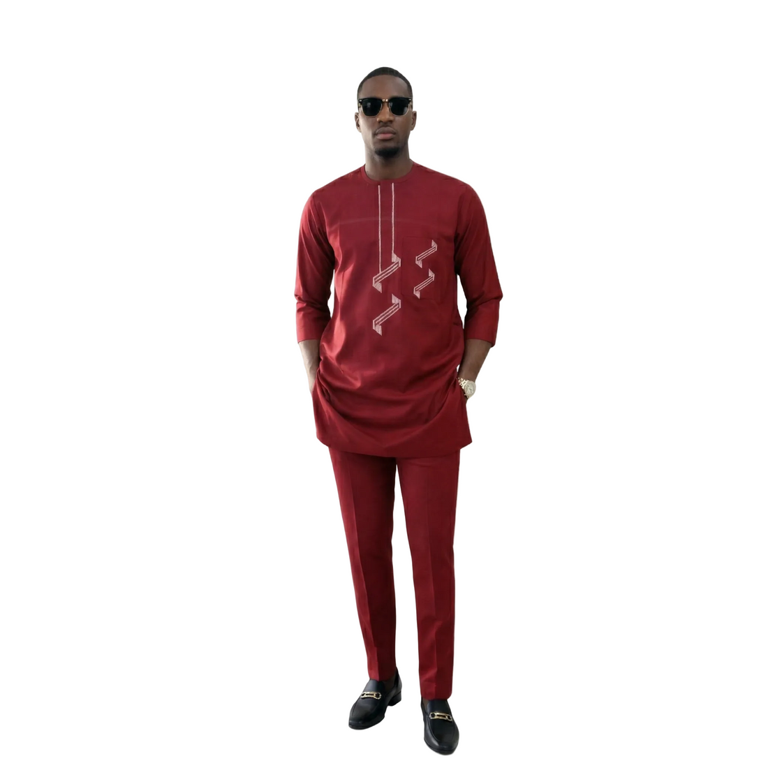 Model wearing the Ìfẹ́lúwà African 2-piece suit in deep burgundy, featuring tailored trousers and a detailed tunic by Adédàmọ́lá Atelier.