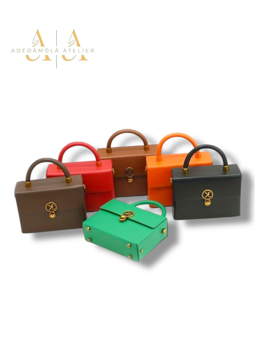 Royale mini trunk bag collection by Adedamola Atelier – six structured vegan leather crossbody bags in brown, red, orange, green and black, Edmonton Canada