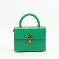 Royale mini trunk bag by Adedamola Atelier – fresh green structured vegan leather crossbody with polished gold hardware, Edmonton Canada