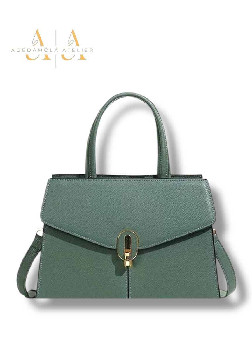 Black handbag with a silver clasp on a white background