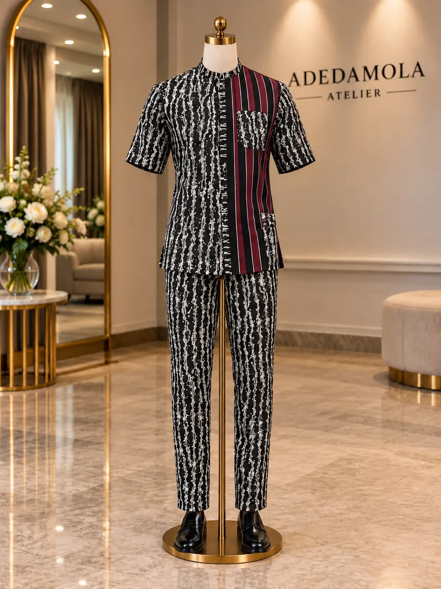 Full-length men’s black and white striped two-piece outfit with burgundy contrast panel