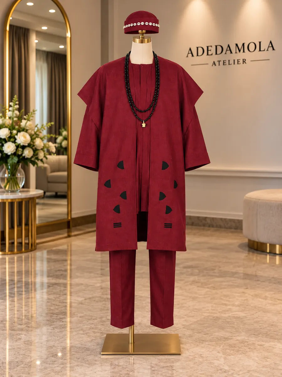 Full-length men’s deep red traditional three-piece outfit with appliqué, beads and matching cap