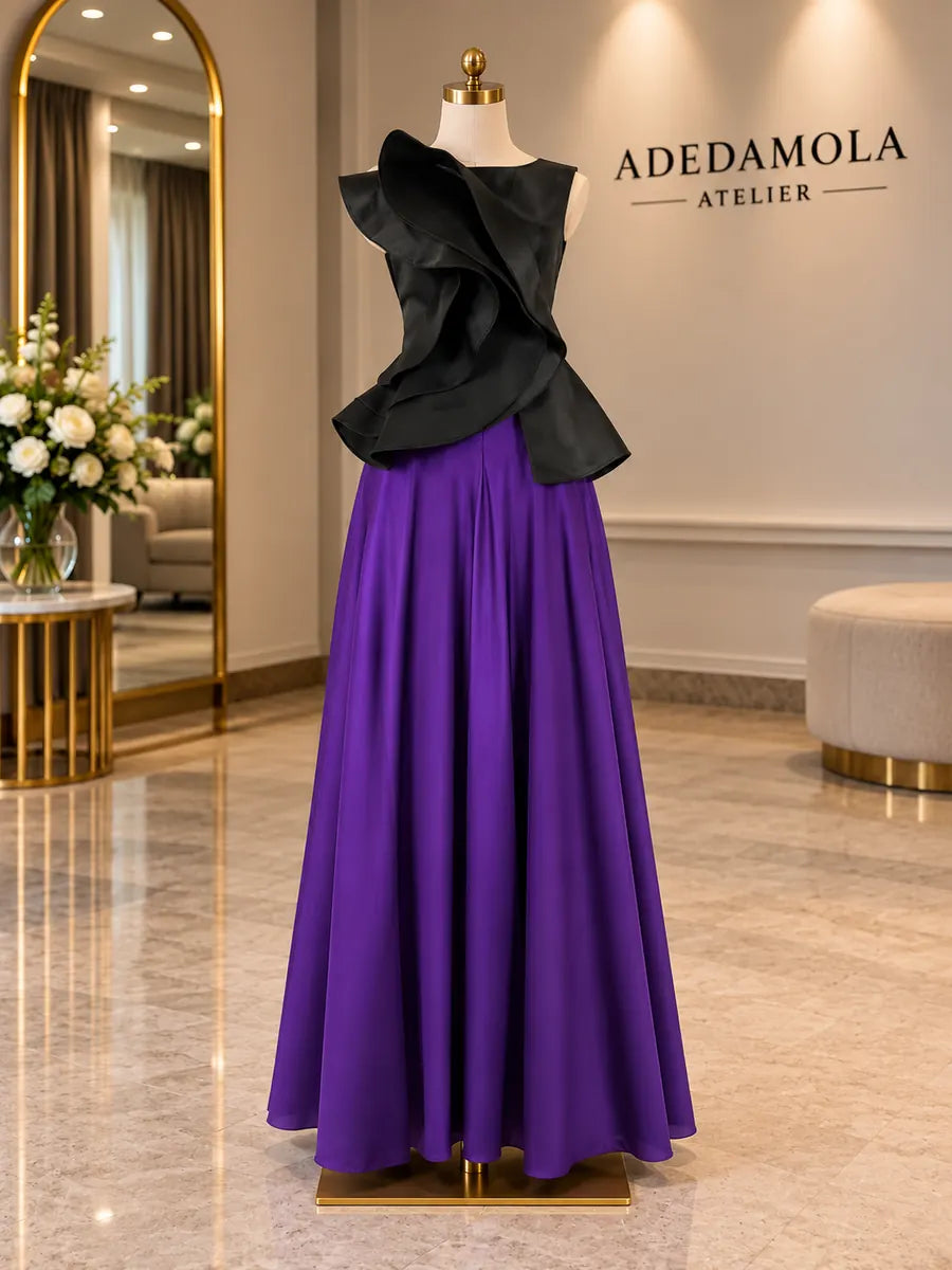 Full-length black sculptural folded top with flowing purple silk chiffon skirt