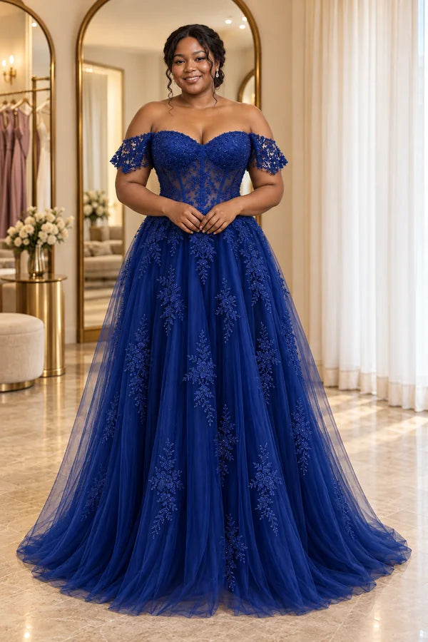 Woman wearing a royal blue off-shoulder lace gown with a full-length tulle skirt.